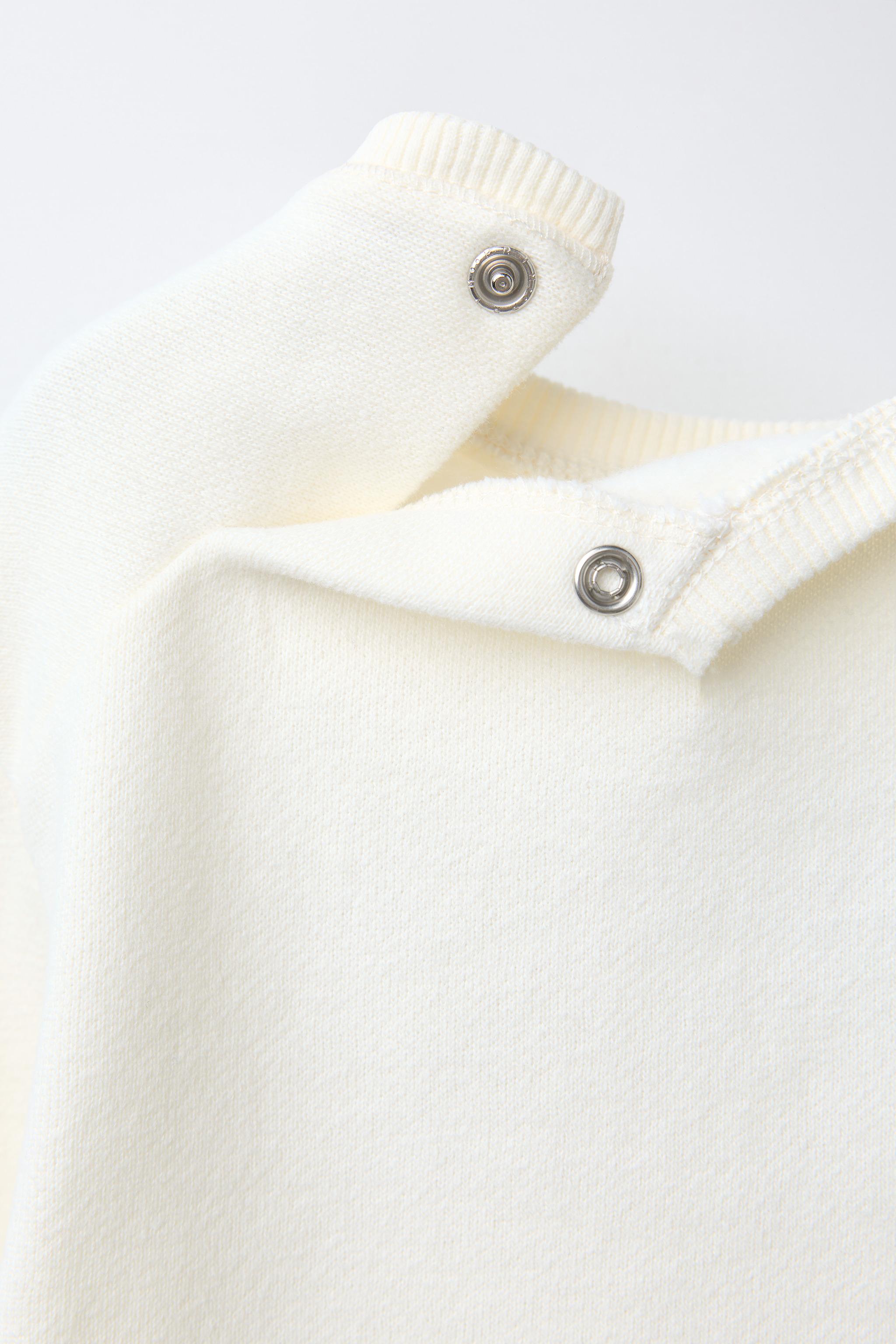 SWEAT AVEC PIÈCE VELOURS BOUCLÉ SNOOPY PEANUTS™